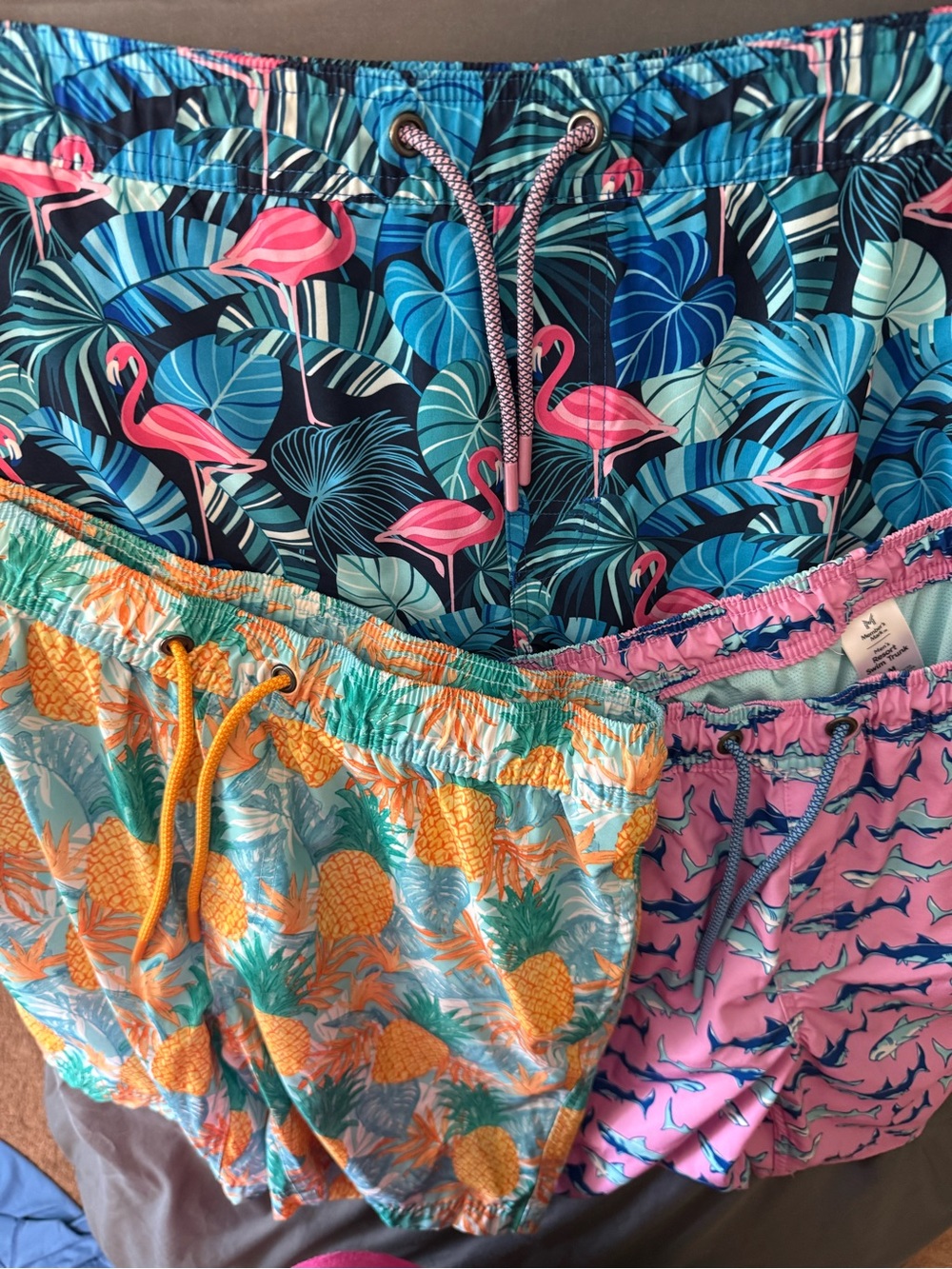 3 pair of men’s swim trunks.